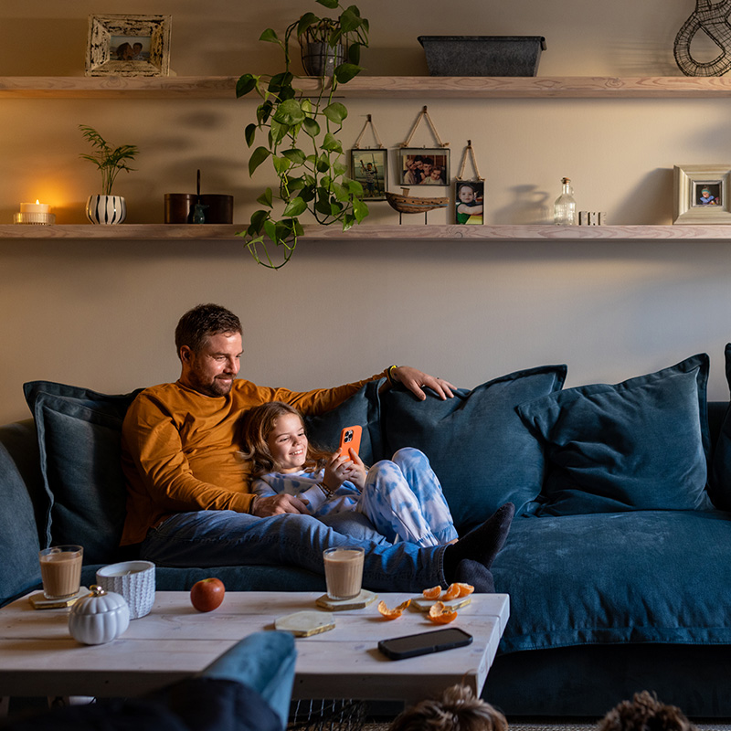 Father and Son Sitting on Couch