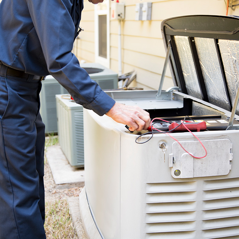 Technician services outside AC units and generator